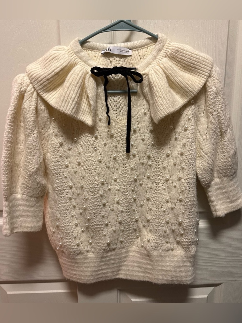 Zara Ivory Pearl-Embellished Ruffle Collar Sweater with Black Tie